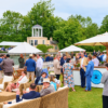 Hospitality guests milling around overlooking temple island and the Thame river