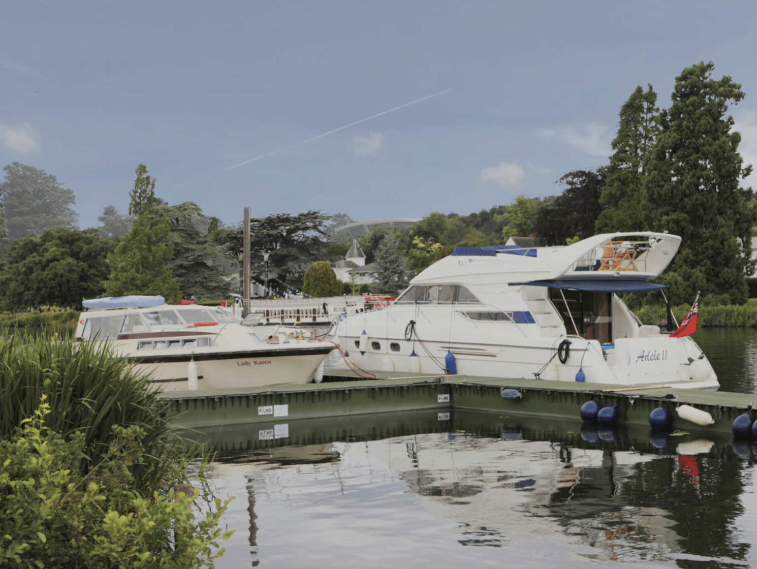 Boats moored along a river at Remenham Farm